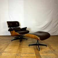 Eames leather armchair with footrest (replica)