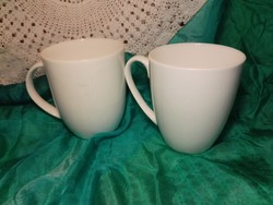 Snow-white porcelain cup, mug.
