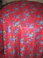 New vintage floral tablecloth on a beautiful red background