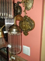 Old renovated wall arm with glass rod
