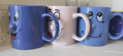 3 smiling mugs from the 90s, one with the inscription 