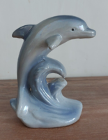 Old unmarked porcelain figurine of a blue dolphin jumping out of the sea, 13 cm high