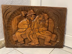 Large carved wooden picture /drunken buddies/ in the basement for the press house