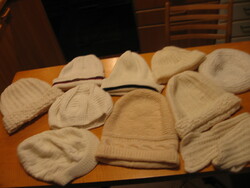 White knitted, crocheted hats and a scarf