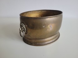 Oval copper flowerpot with a lion's head