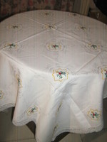 Beautiful hand-embroidered damask tablecloth with a lace edge