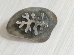 Silver-plated craftsman pin with lichen motif. From the legacy of the 