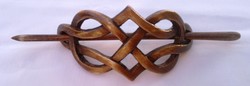 Bun decoration with Celtic motif carved from wood