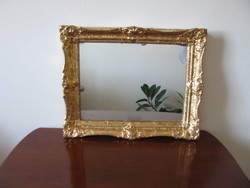 Mirror in gold smoke frame