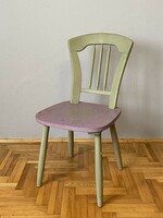 Stable wooden chair painted green and purple