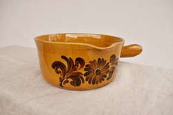 Folk ceramic bowl with a handle