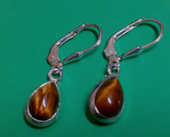 In good condition marked sterling silver hook-and-loop earrings studded with tiger eye stones with a secure switch