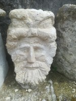 Antique guardian stone, limestone statue head