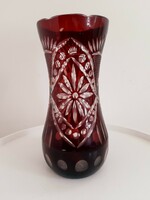 Old burgundy polished glass vase