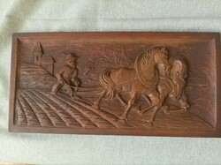 A wall picture carved from wood.