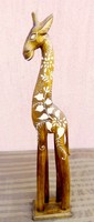 Exotic handmade decoration. Painted ornate giraffe wooden sculpture from Indonesia