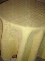Woven tablecloth with a beautiful yellow lacy edge