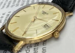 Men's gold tissot wristwatch