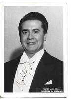 Autograph, dedicated, handwritten signature of Giuseppe di stefano, an Italian world-famous opera singer, on a photo page.