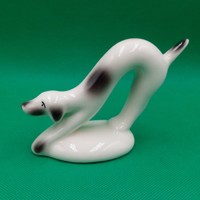 Stretching porcelain dog figure in art deco style