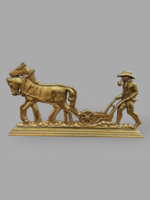 Plowing worker copper statue