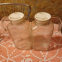 2 glass jugs together