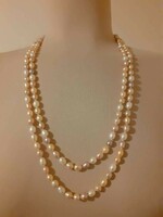 Long multi-colored cultured pearl necklace individually knotted