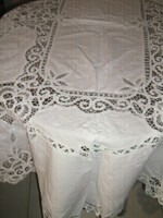 Wonderful ribbon sewn on special pink and white lace tablecloth