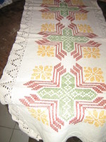 Antique woven tablecloth with a lace edge embroidered with a beautiful cross stitch