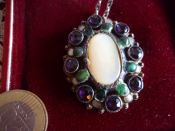 Antique silver brooch - and medallion in one - decorated with a huge mother-of-pearl and many almadines -