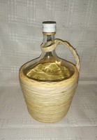 Glass bottle in wicker holder (a7)