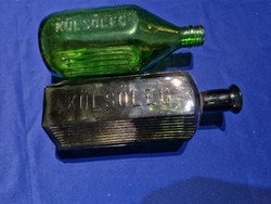 Old pharmacy bottles with inscriptions on the outside