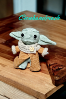 Baby yoda hand crocheted with amigurumi technique