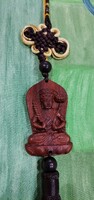 Real room. Rosewood pendant, amulet, akasagarbha bodhisattva