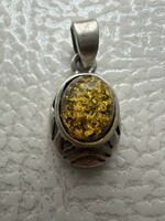 Antique silver pendant with amber stone