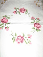 Beautiful vintage pink hand-embroidered woven tablecloth with a lace edge