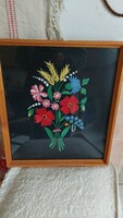 Hand-embroidered floral picture in a glazed frame