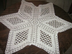 Beautiful hand-crocheted star-shaped white lace tablecloth