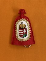 Coat-of-arms key ring with needle tapestry insert, red felt base.