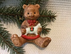 Teddy bear Christmas tree ornament holding a porcelain rocking horse
