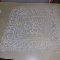 Crocheted white rectangular tablecloth