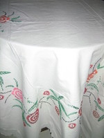 Beautiful antique hand embroidered floral pattern with lacy edged tablecloth