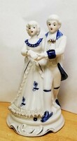 Dancing couple. Porcelain nip. Baroque style with blue painting