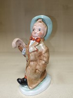 Art ceramic little boy with an umbrella