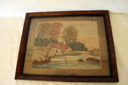 Old tapestry in a wooden frame