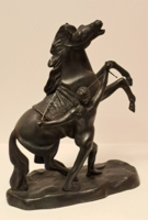 Bridling a horse. Numbered metal sculpture