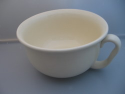 Retro earthenware cream-colored potty, bedside table