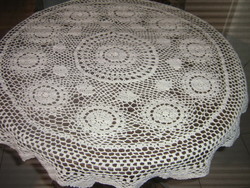 Beautiful white antique hand-crocheted round floral tablecloth