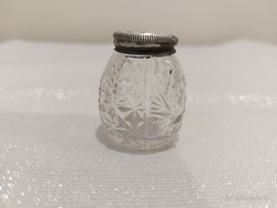 Polished glass salt and pepper shaker with old silver lid.