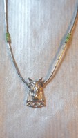 Unique silver chain with horse head motif.